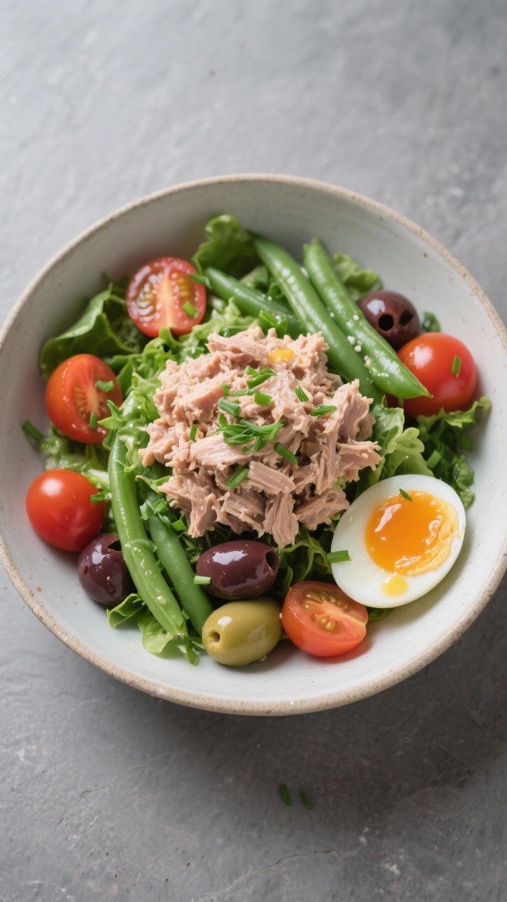 Tasty top view: Overhead shot of a Niçoise-ish tuna salad bowl: a generous scoop of the tuna salad 